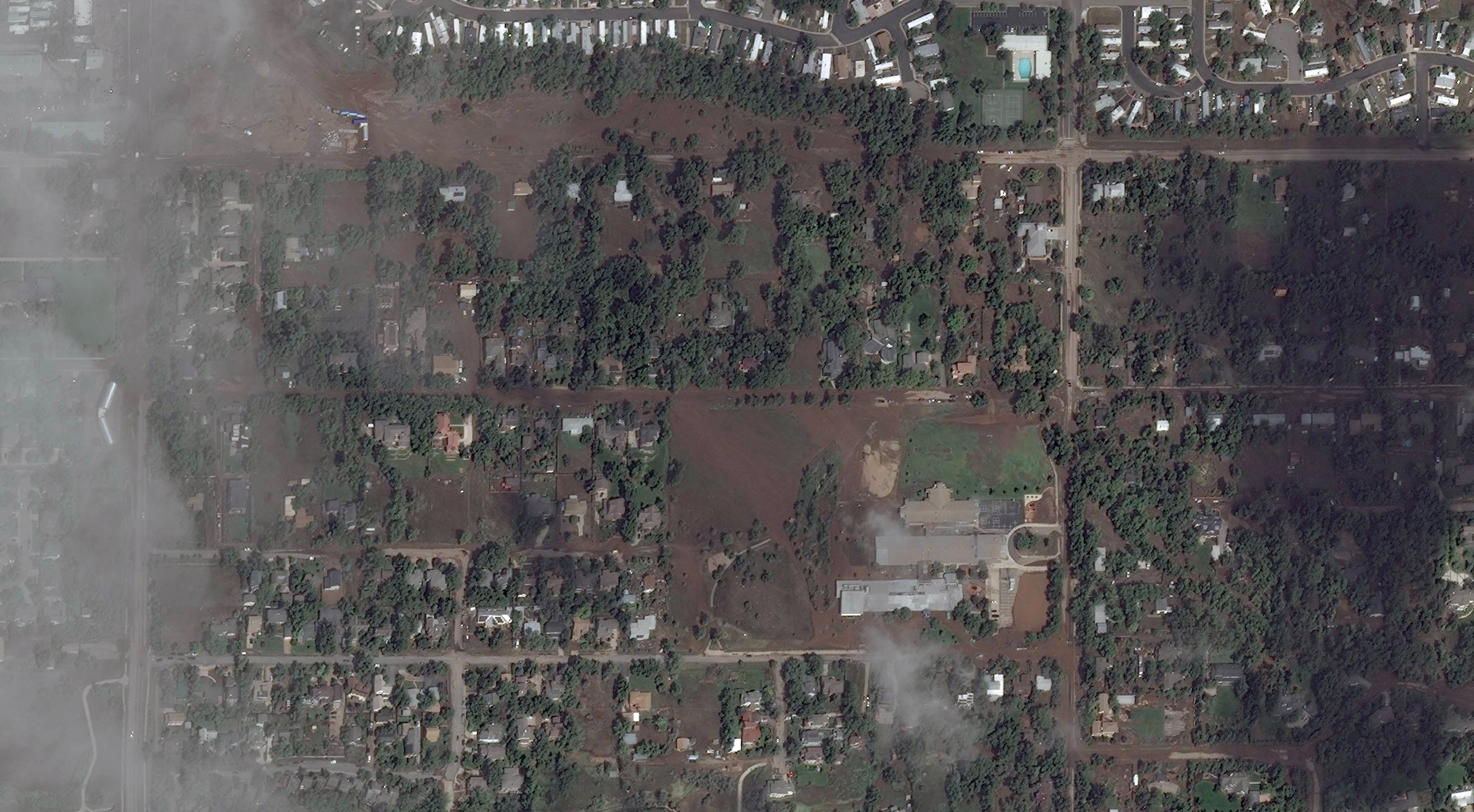 Aerial image of Boulder after the 2013 flood.  Notice that the floodwaters carried so much sediment that they appear brown in color
