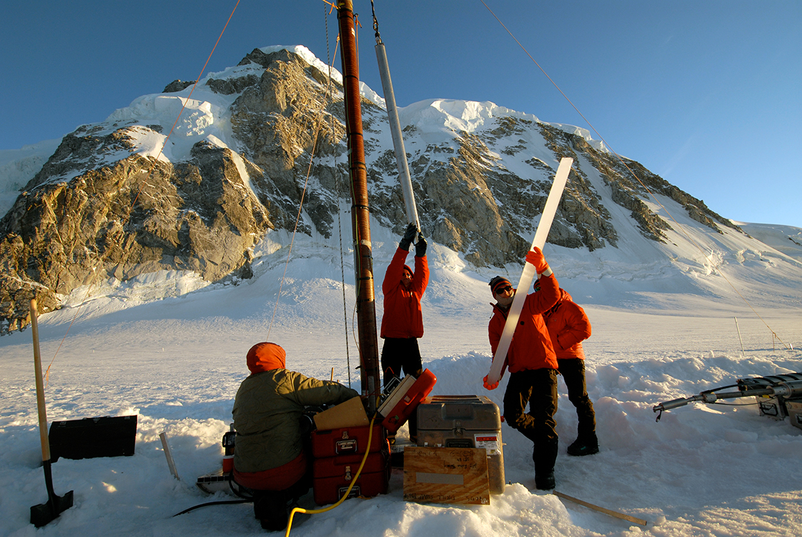 This is a photo of researchers using drill rigging to extract ice cores on a glacier in British Columbia.