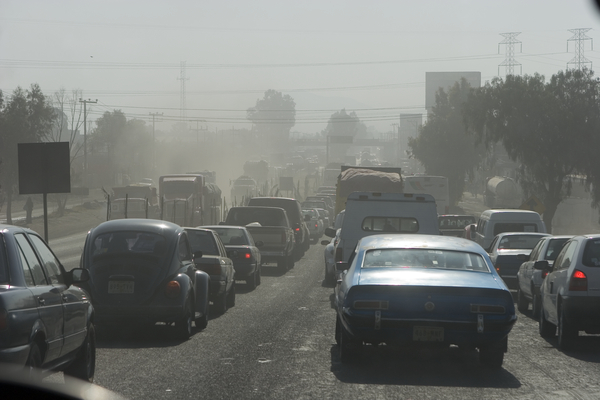 Vehicle traffic in Mexico City creates hazy conditions due to air pollution
