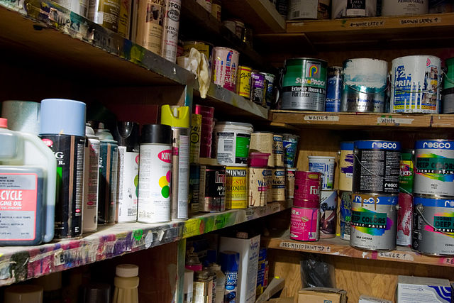 This is a photo of shelves full of household cleaners and chemicals that can release VOCs into the air.