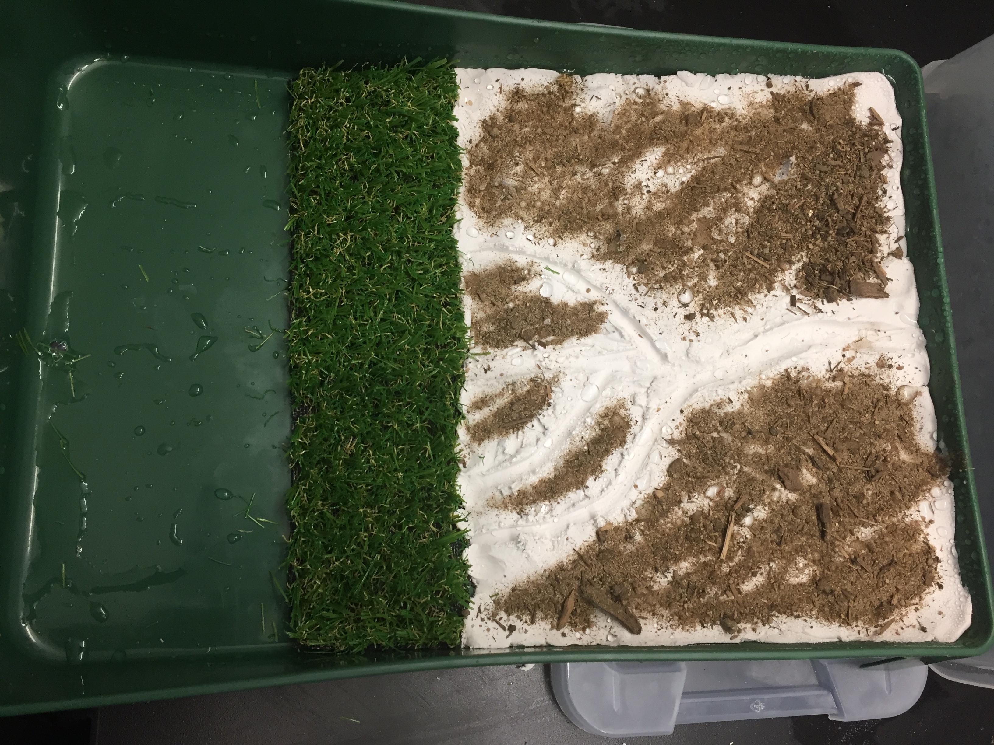 A photo showing the addition of soil to the model