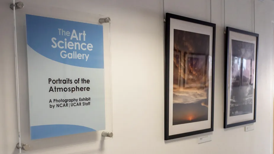 The welcome sign to the art-science gallery with the exhibit titled “Portraits of the Atmosphere. A Photography Exhibit by NCAR | UCAR Staff.”