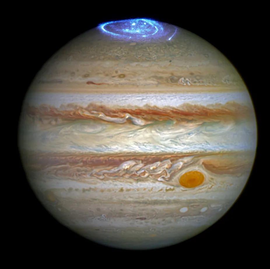 Glowing lights spiral around the north pole of Jupiter.
