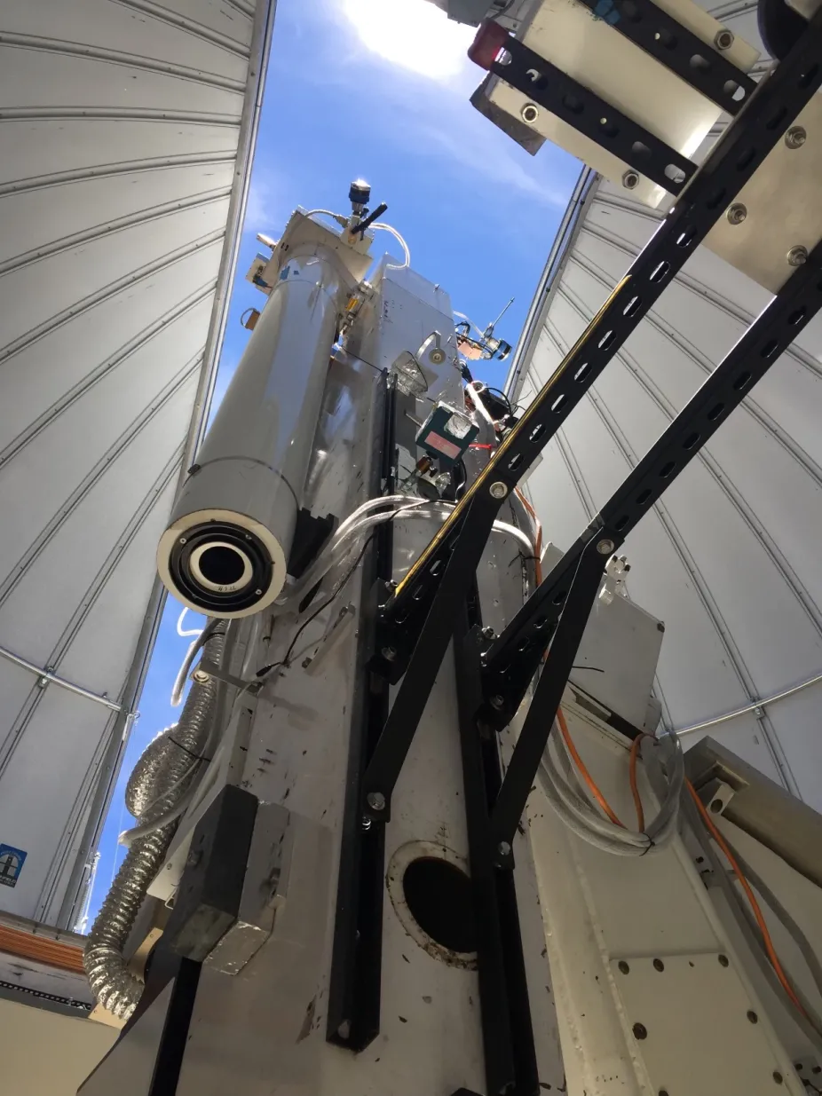 A telescope that points up to the sky from within the Mauna Loa Observatory in Hawaii.