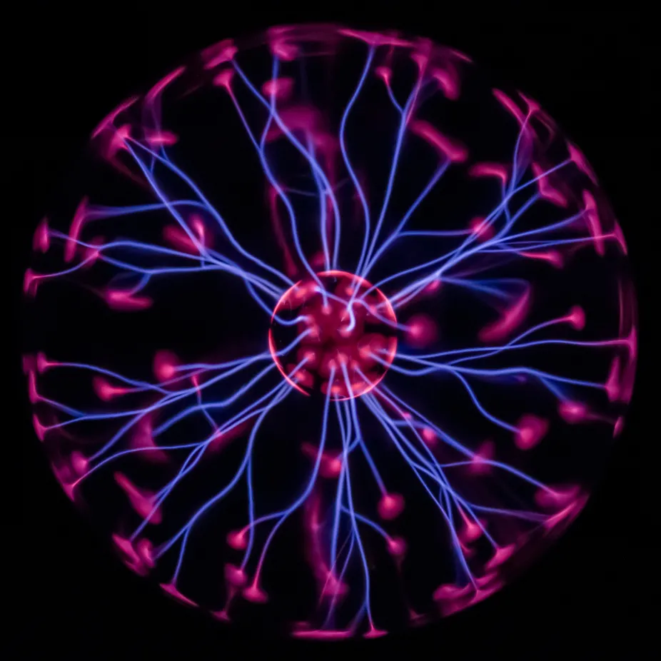 A plasma ball with colored filaments extending between the inner and outer spheres.