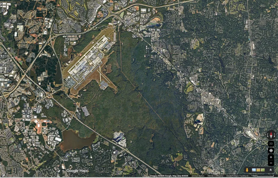 The unshaded airport is surrounded by vegetated surface covering, which will be much cooler in temperature than the concrete airport runway system.