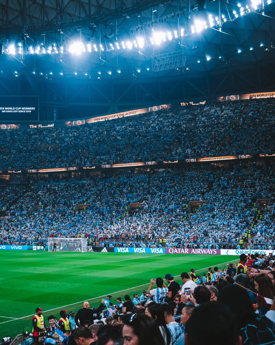 photo of a stadium filled with fans during a summertime World Cup soccer match