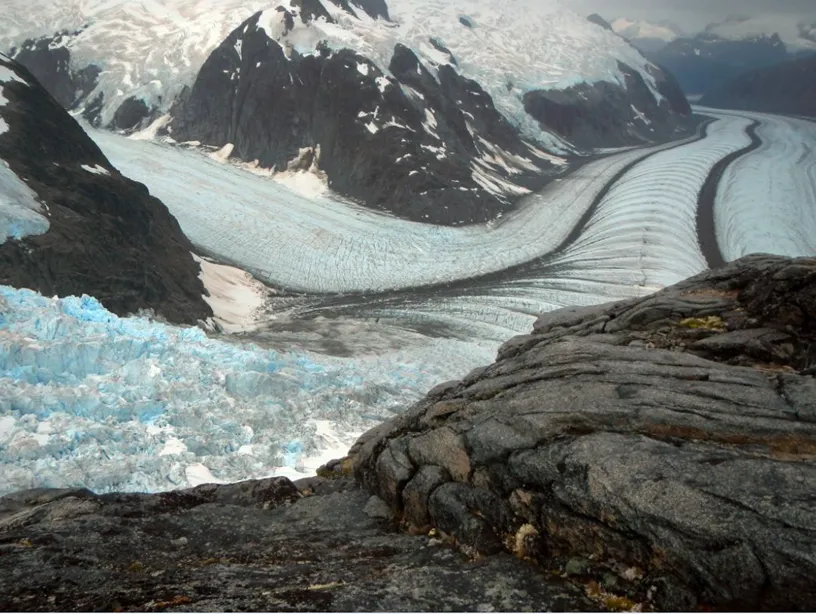 photo of a glacier in mountainous terrain