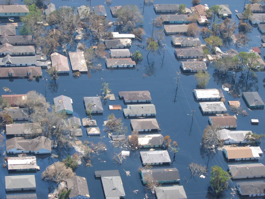 Birdseye view of a neighborhood with floodwaters filling the roads and yards