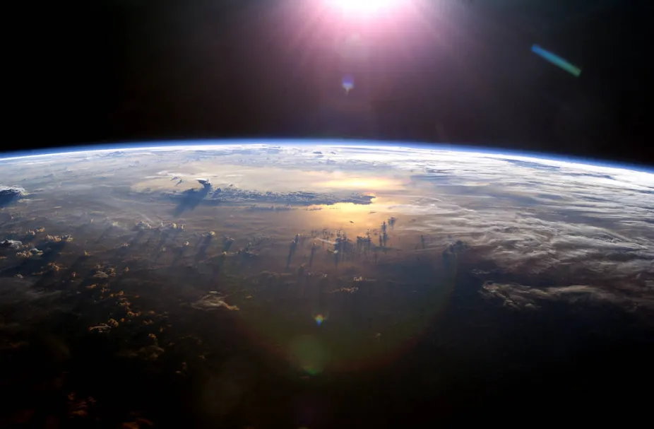 view of Earth and the Sun from the International Space Station