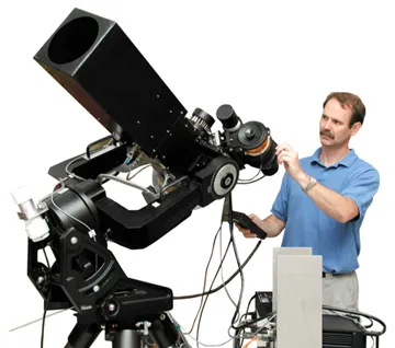 Photo of Tim Brown with a telescope