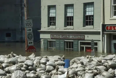 Sandbags holding floodwaters back in a town during a Midwest flood