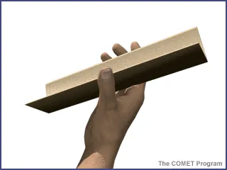 A piece of cardboard folded to make a ramp.