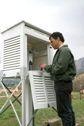 Photo of man checking equipment