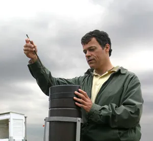 Photo of man checking equipment