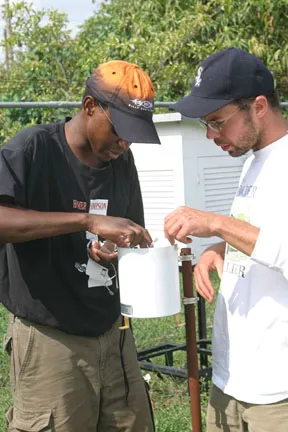 Two men looking at field equipment