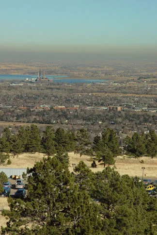 Landscape view of Boulder, Colorado with a thin brown cloud along the horizon