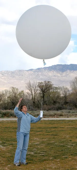 Scientist launching weather balloon