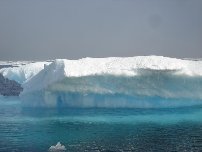 water dripping off ice melting in the arctic