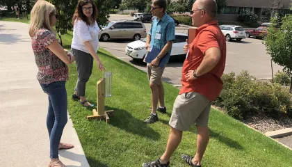 Four teachers outside doing an activity