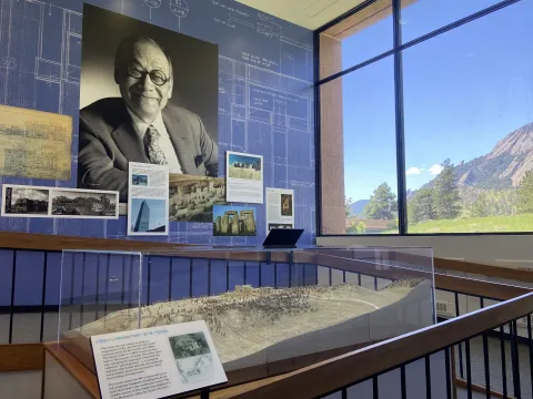 One side of the Architecture exhibit with a large photo of I.M. Pei smiling.