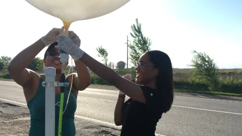 Researchers with a weather balloon