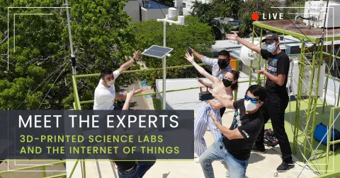 A photo of a group of people outside wearing face masks and pointing to a weather station that they built using 3D printed parts.