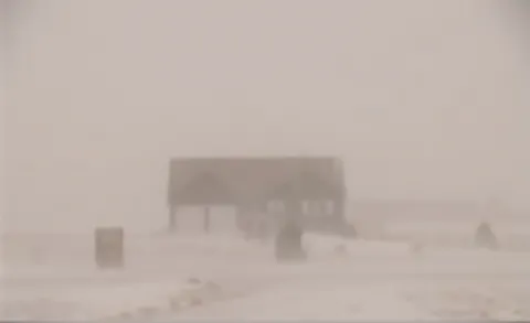 Blowing snow during a blizzard reduces visibility.