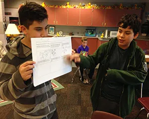 Two students explaining their UAV disaster storyboard