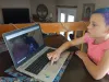 A kid using the Virtual Visit 360 application from home